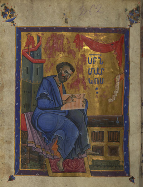 A full-page illuminated page that depicts a bearded man seated on a bench and writing text in an open book next to a desk. There is Armenian text on the right side of the illumination.