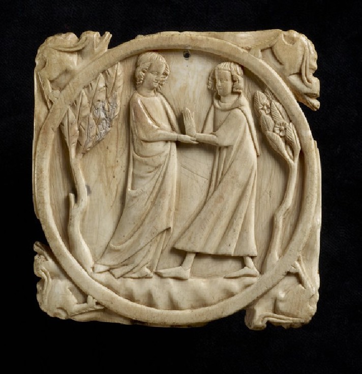 Round, carved ivory mirror case cover decorated with male and female figures, standing between trees, one with joined hands raised. On the four corners of the beveled edge are four crouching beasts with long ears.