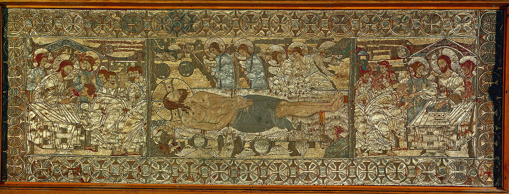 A textile embroidered with multiple figures.