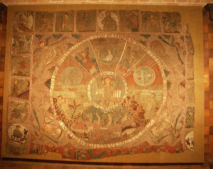An embroidered tapestry depicting God surrounded by biblical scenes, personifications of the months, and other figures.