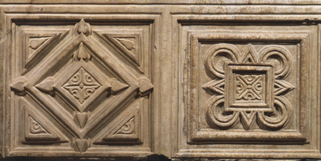 Two marble square panels, each containing ornamental motifs.