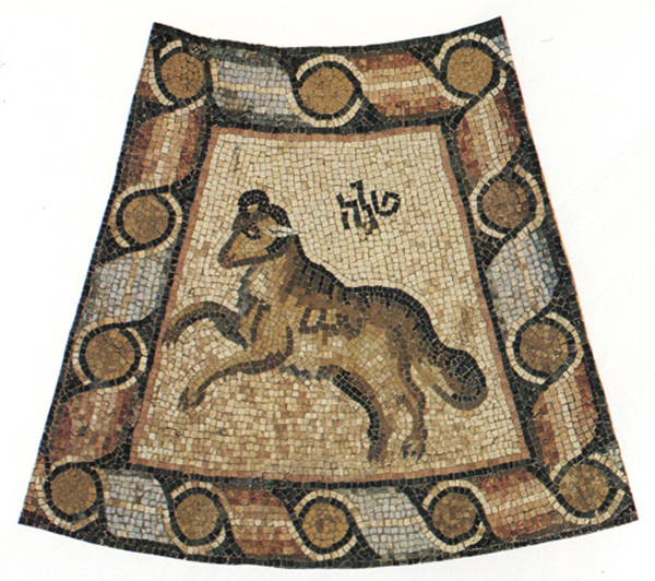 Detail of mosaic pavement depicting leaping ram, symbolizing the Zodiac Sign of Aries, inscribed with Hebrew letters and surrounded by ribboned border of alternating red and blue tiles.
