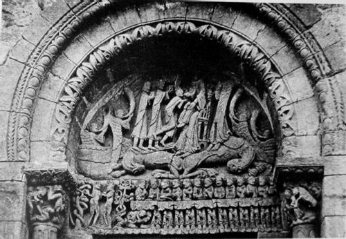 General black and white view of relief sculpture on portal containing many figures. 