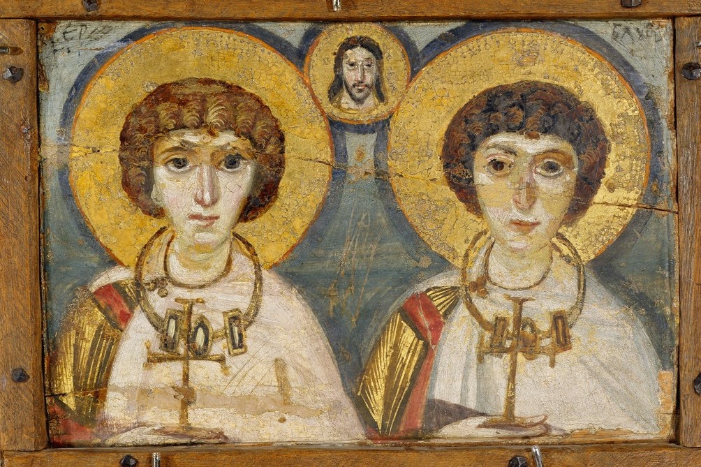 Panel painting with depiction of three male busts, all with haloes, two holding crosses.