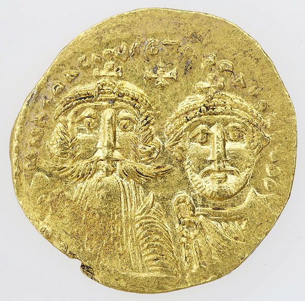 The obverse of a gold coin with busts of two men, both crowned, the figure on the left wearing a long beard and the figure on the right wearing a short beard, with a cross and an inscription in the field above them.