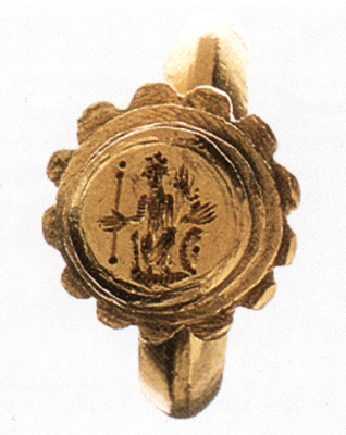A gold ring with a scalloped medallion containing an image of a crowned woman holding a spear and a horn of plenty.