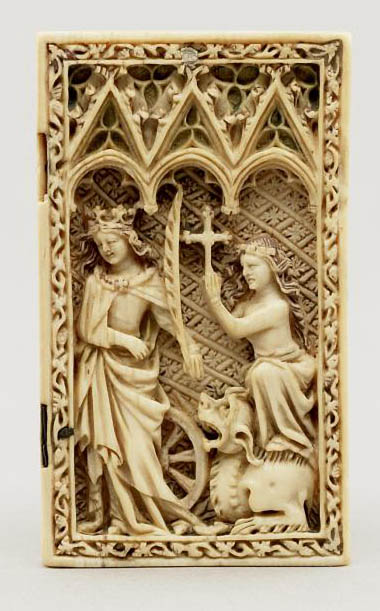 On a carved ivory panel, a woman standing next to a wheel and holding a palm branch, and a woman standing with one foot on a dragon and holding a cross.