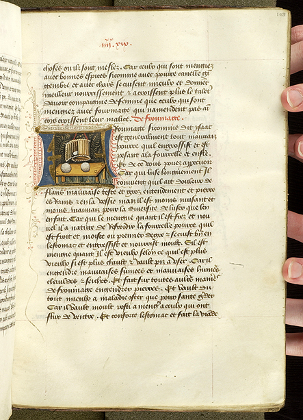 Whole page of a manuscript of French text and a decorated initial L enclosing a scene of cheesemaking.