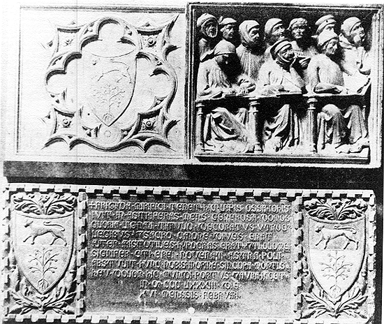 Group of carved panels, including rectangular panel with group of ten man, wearing headgear and three in front of desks, and three coats of arms, the bottom two flanking inscription.