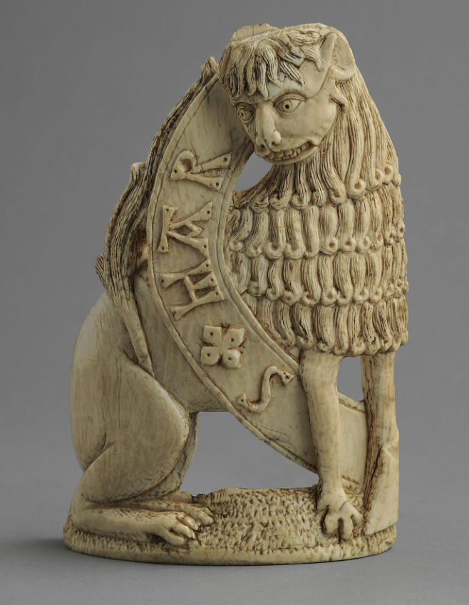 Ivory representing lion with open scroll with inscription