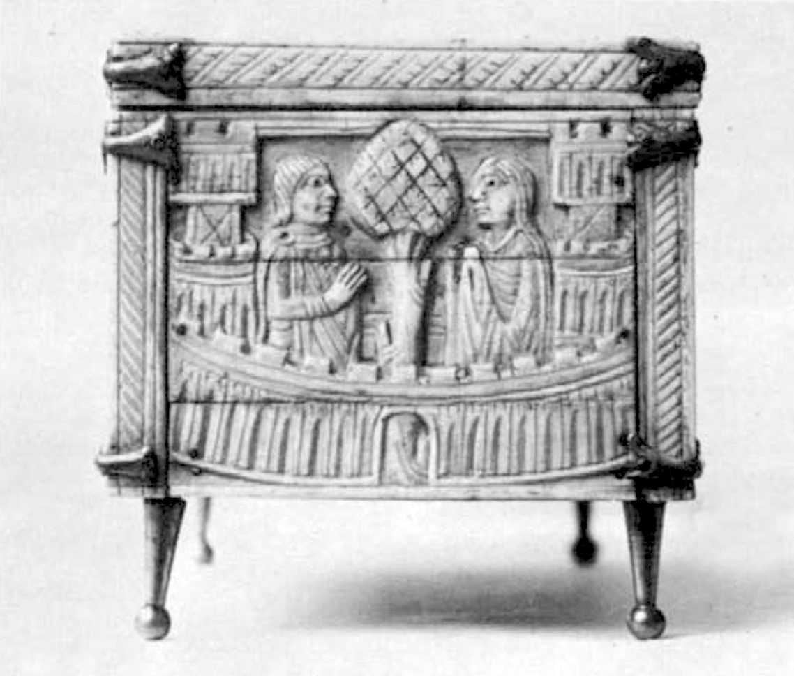 Carved end of an ivory casket depicting half figures of man and woman flanking stylized tree and two crenellated towers on either side. Decorated balcony, fluted borders, and metal supports.