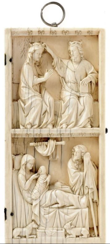 An ivory wing of a diptych carved in two scenes. The upper scene, a veiled woman crowned by a bearded man, both seated on a bench. The lower scene, a veiled woman, holding a swaddled infant, and a bearded man by the foot of her bed; animals and crib in foreground. The upper part of the wing with a metal ring for suspension, and small chip at lower border.