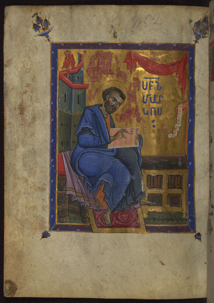 A full-page illuminated page that depicts a bearded man seated on a bench and writing text in an open book next to a desk. There is Armenian text on the right side of the illumination.