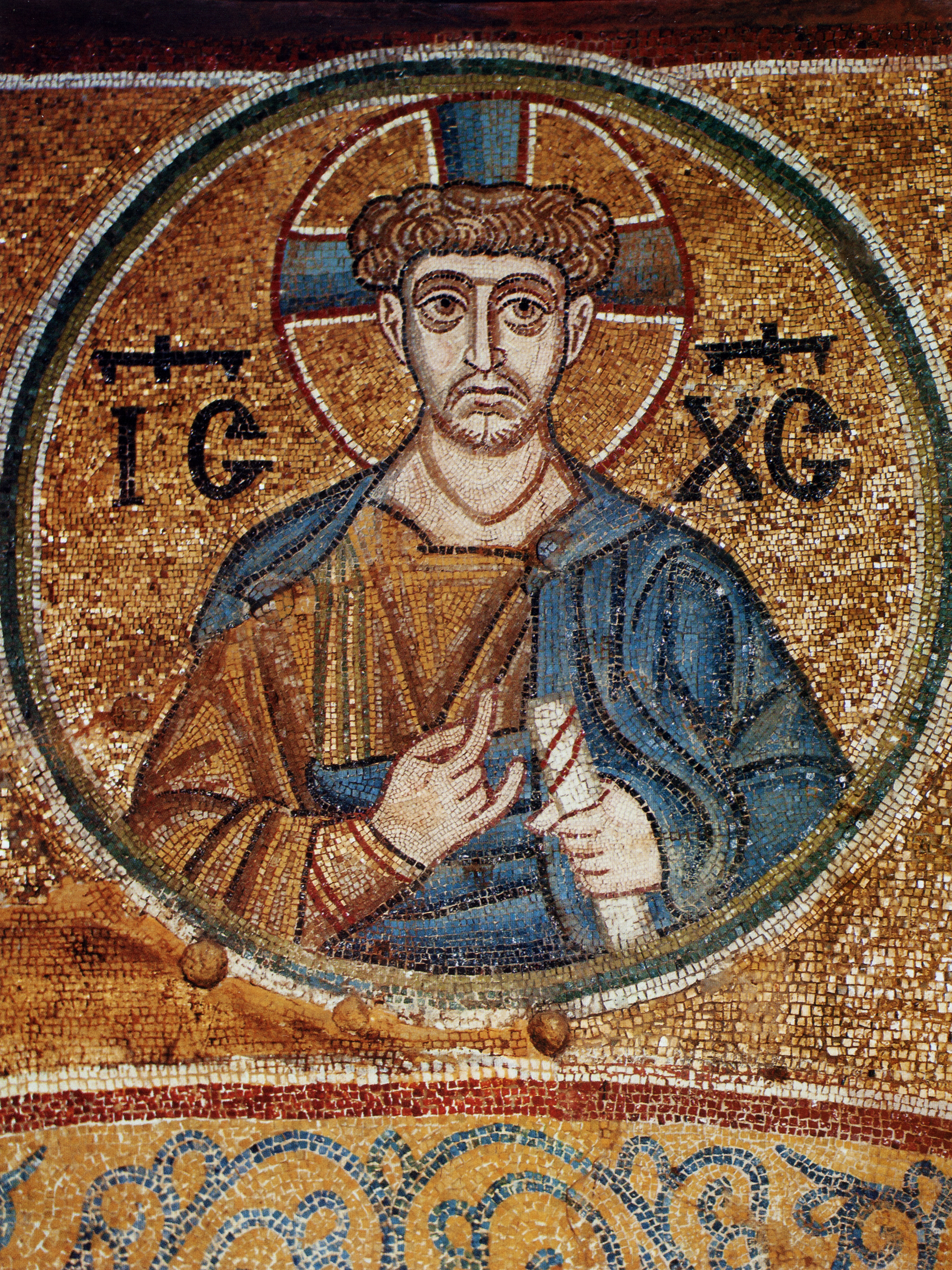 Mosaic of male figure holding scroll in medallion